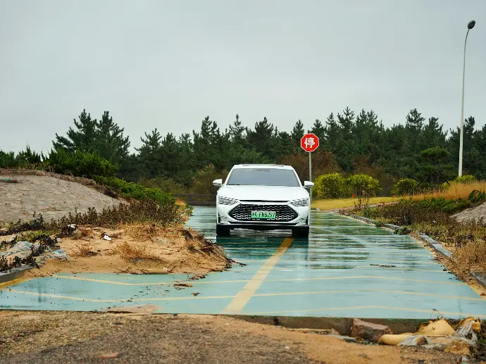 a car driving through a flooded road